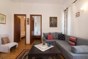 a living room with a couch and a table at Angel's House in Volímai