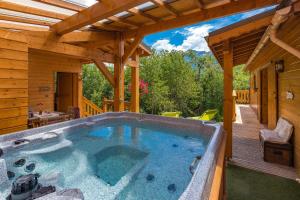 a large swimming pool in the middle of a house at Gite&Spa le Montagnard in Saint-Jean-Saint-Nicolas