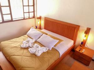 Postel nebo postele na pokoji v ubytování Hotel La Primavera