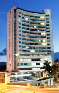 a large office building with a lot of windows at Estelar Apartamentos Medellin in Medellín