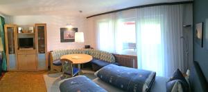 a living room with a couch and a table at Ferienwohnung Brigitte in Schruns