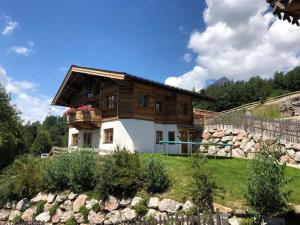 a house on top of a hill at Family Retreat Maria Alm in Maria Alm am Steinernen Meer