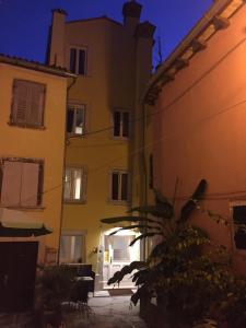 a building in the night with a building at Casa Colloredo Free Parking in Rovinj
