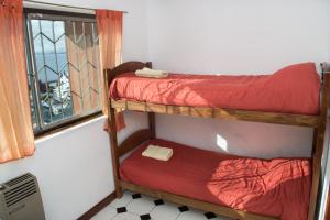 Postel nebo postele na pokoji v ubytování Hostel Inn Bariloche