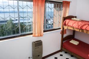 Postel nebo postele na pokoji v ubytování Hostel Inn Bariloche