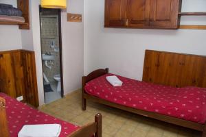 Postel nebo postele na pokoji v ubytování Hostel Inn Bariloche