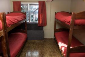 Postel nebo postele na pokoji v ubytování Hostel Inn Bariloche