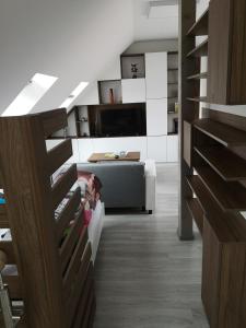 a living room with a bed and a couch at Centrum Apartman LEYLA 6 in Bardejov
