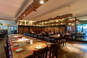 a large dining room with a long table and chairs at Centro Hotel Stern in Ulm