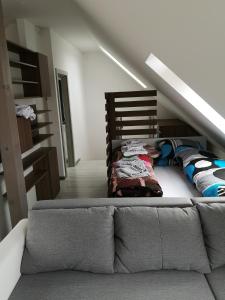 a bedroom with a bunk bed and a staircase at Centrum Apartman S- dom in Bardejov