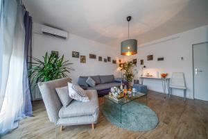 a living room with a couch and a table at Apartment Happy Day in Varaždin