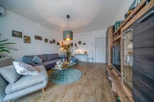 a living room with a couch and a table at Apartment Happy Day in Varaždin