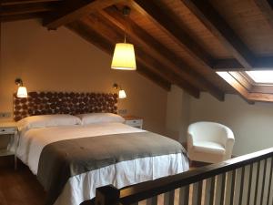 Кровать или кровати в номере Playas de Luarca