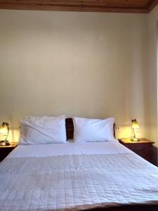 Postelja oz. postelje v sobi nastanitve Nimbus Guesthouse