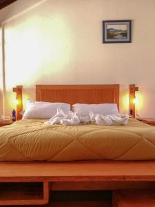 Postel nebo postele na pokoji v ubytování Hotel La Primavera