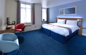 
Un pat sau paturi într-o cameră la Travelodge Dublin City Rathmines
