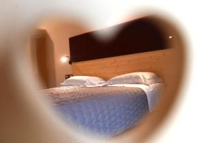 Postel nebo postele na pokoji v ubytování Albergo Sporting