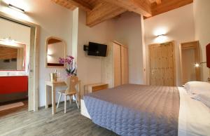 A bed or beds in a room at Albergo Sporting