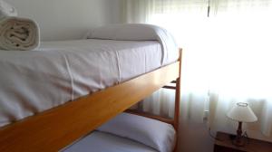A bed or beds in a room at La Caseta del Pitxo