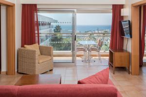 a living room with a view of the ocean at Alfagar Alto da Colina in Albufeira