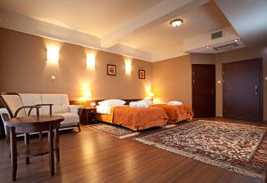 Posteľ alebo postele v izbe v ubytovaní Hotel Słoneczny Młyn