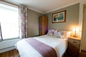 Ένα ή περισσότερα κρεβάτια σε δωμάτιο στο Brennan's Accommodation Glenties