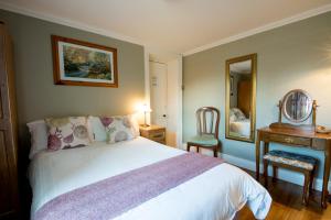 Ένα ή περισσότερα κρεβάτια σε δωμάτιο στο Brennan's Accommodation Glenties