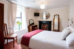 Ένα ή περισσότερα κρεβάτια σε δωμάτιο στο Brennan's Accommodation Glenties