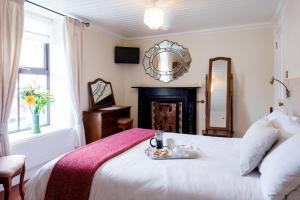 Ένα ή περισσότερα κρεβάτια σε δωμάτιο στο Brennan's Accommodation Glenties