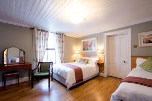Ένα ή περισσότερα κρεβάτια σε δωμάτιο στο Brennan's Accommodation Glenties