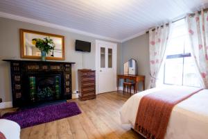 Ένα ή περισσότερα κρεβάτια σε δωμάτιο στο Brennan's Accommodation Glenties
