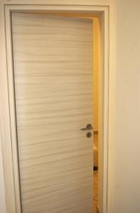a white door in a room with a door at La Terrazza sul Mare in Capri