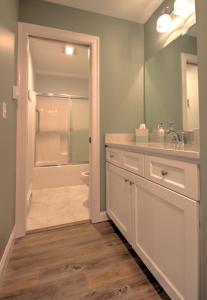 a bathroom with a toilet and a sink and a shower at Atlantic Ocean Suites in Old Orchard Beach