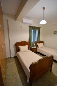 Posteľ alebo postele v izbe v ubytovaní Athevillas Chrysoula