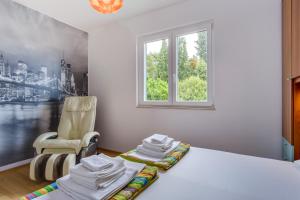Postel nebo postele na pokoji v ubytování KON-TIKI Apartments