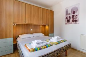 Postel nebo postele na pokoji v ubytování KON-TIKI Apartments