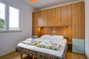 Postel nebo postele na pokoji v ubytování KON-TIKI Apartments