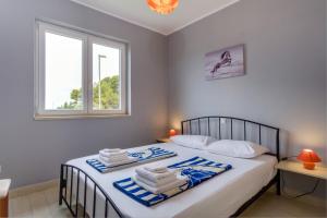 Postel nebo postele na pokoji v ubytování KON-TIKI Apartments