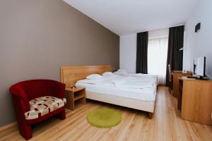 Postel nebo postele na pokoji v ubytování Hotel Mátrix + 37 fotografií