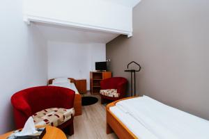 Ένα ή περισσότερα κρεβάτια σε δωμάτιο στο Hotel Mátrix
