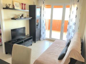 TV a/nebo společenská místnost v ubytování Apartament El Castillo De Bonalba