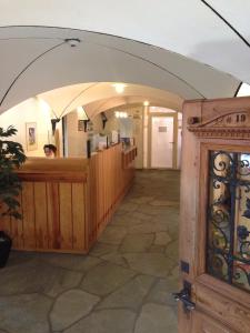 a bar in a building with an archway at Hotel Restaurant Kulm in Triesenberg