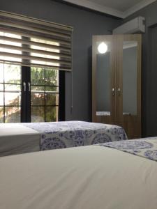 Postel nebo postele na pokoji v ubytování Seyran Seaside Apartments - 1-dublex