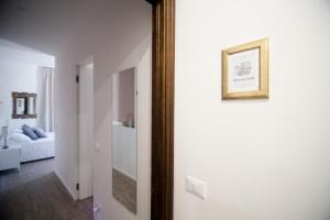Postel nebo postele na pokoji v ubytování aMarti Suites B&B