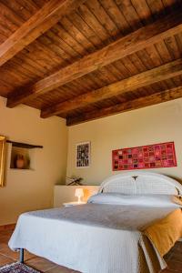 En eller flere senge i et værelse på Donna Giulia