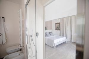 Postel nebo postele na pokoji v ubytování aMarti Suites B&B