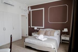 Postel nebo postele na pokoji v ubytování aMarti Suites B&B