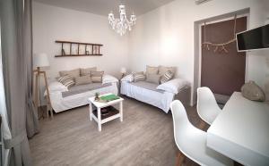 Postel nebo postele na pokoji v ubytování aMarti Suites B&B