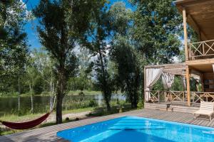 a house with a swimming pool and a deck at Relax villa Poduzska in Sinyak