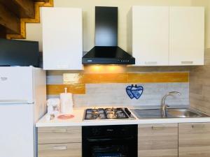 Kuchyň nebo kuchyňský kout v ubytování Simone Home